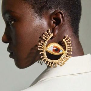 Schiaparelli inspired earring baroque look